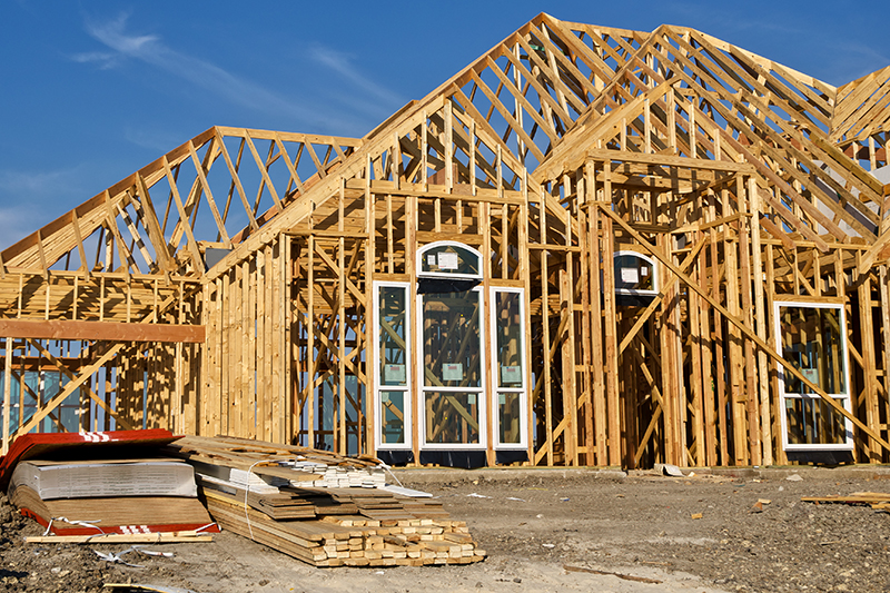 Wood beam framing of a new house being constructed before a home inspection is preformed